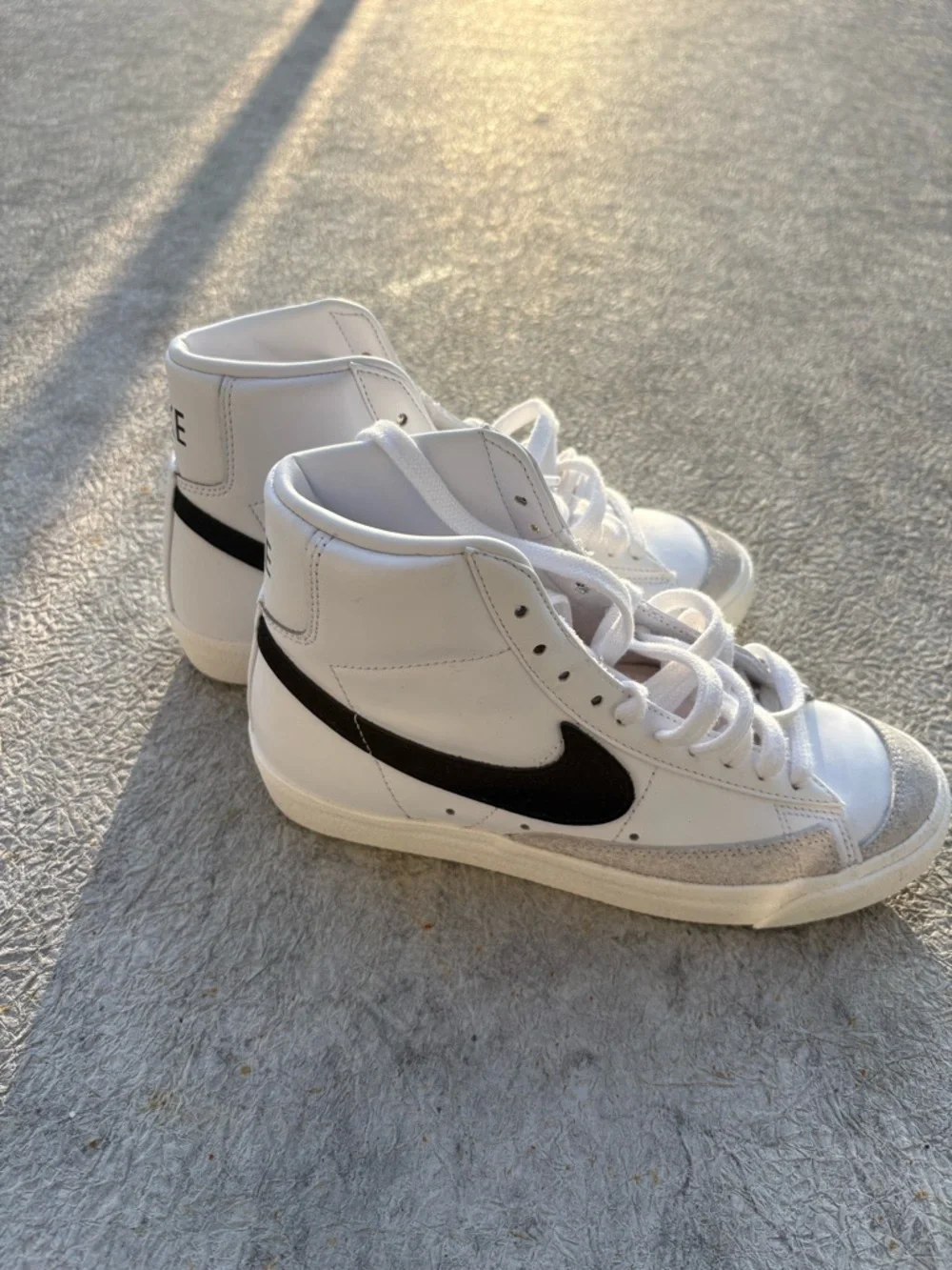 Nike White High-Top Sneakers with Black Swoosh - Picture 1 of 4